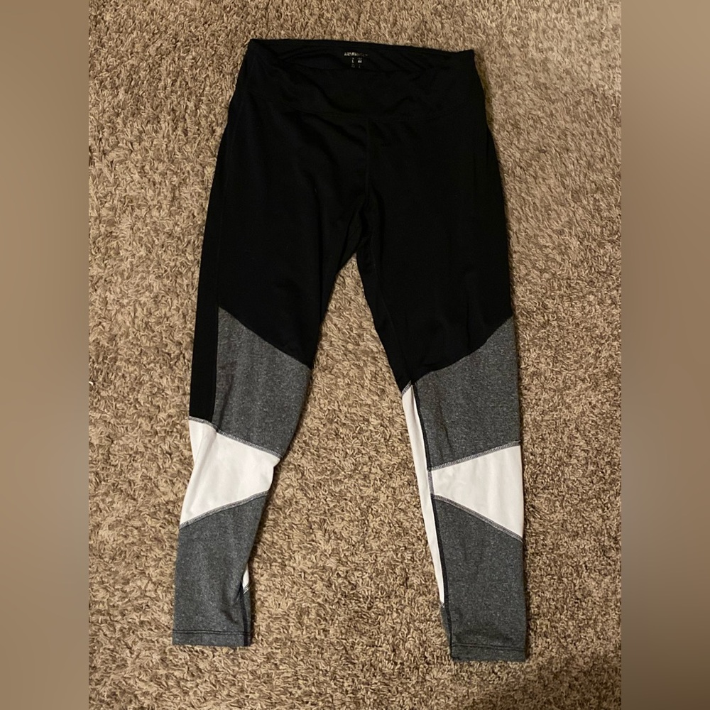 Black athletic leggings with grey and white design